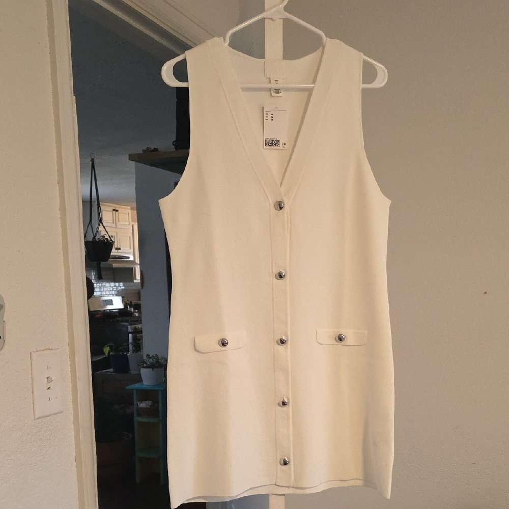 Cream Colored Sleeveless Button-Down dress.